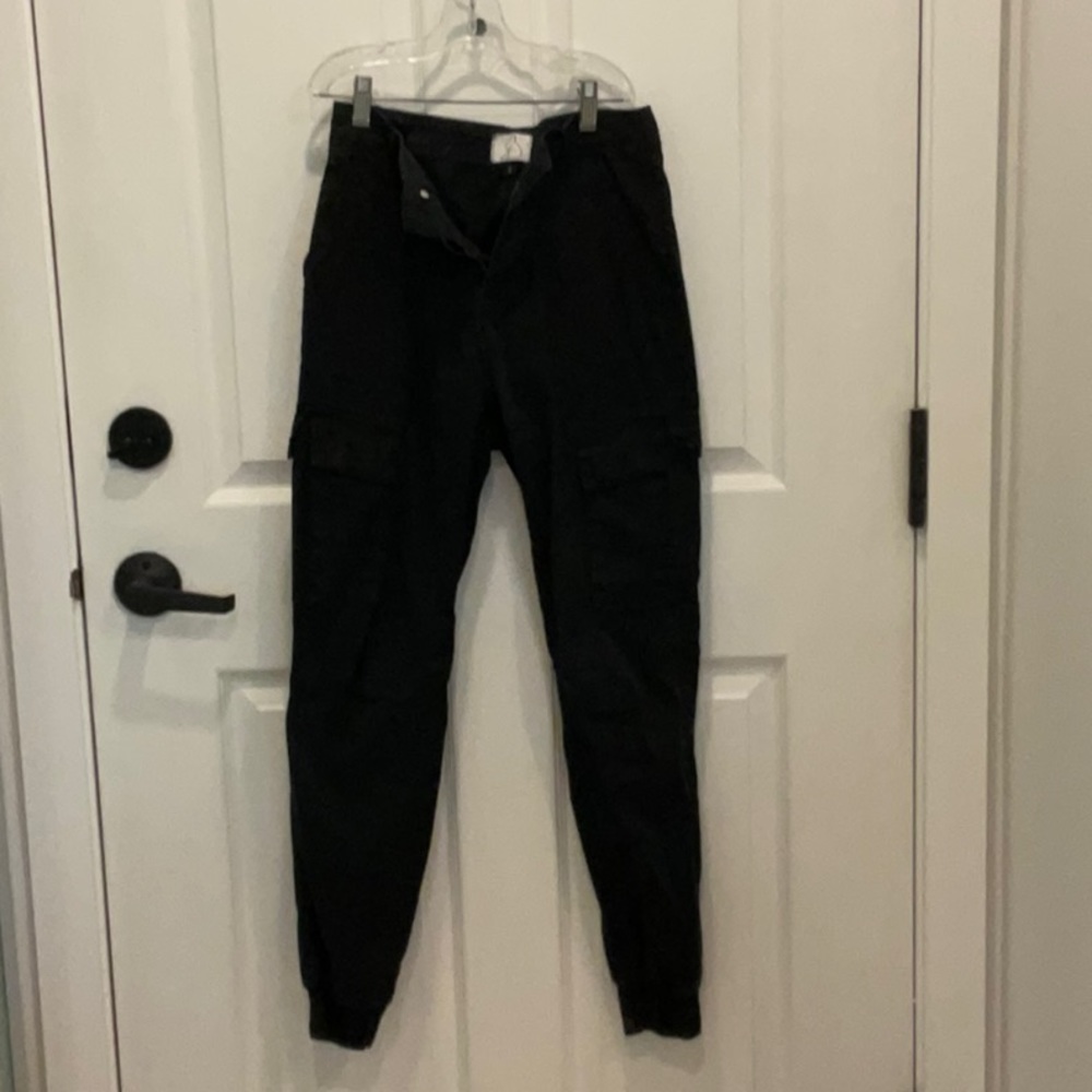 Kuwallatee cargo pants, elastic ankle, black, size S.